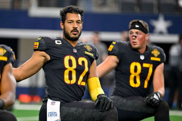 Washington Commanders tight ends Logan Thomas (82) and John Bates (87) prepare for a game against the Dallas Cowboys.